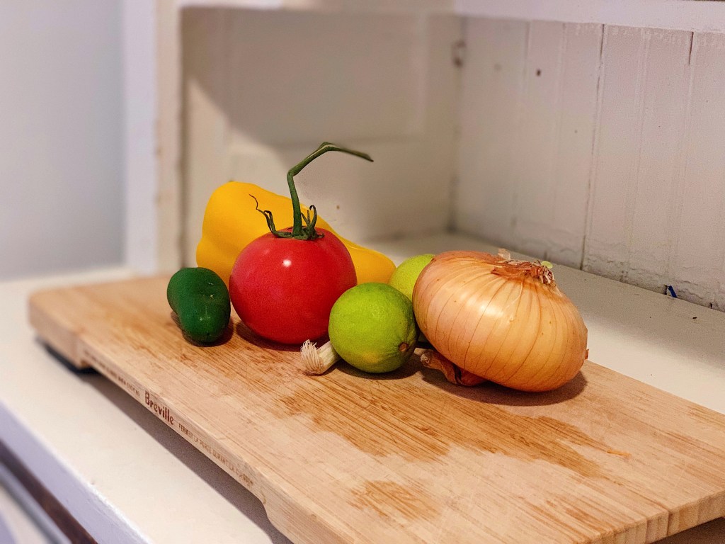 Jalapeño, bell pepper, tomato, lime, and onion for Vegan Sweet Potato Burritos with Avocado Pico de Gallo